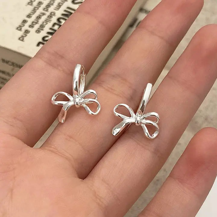 Silver Bow Huggie Earrings