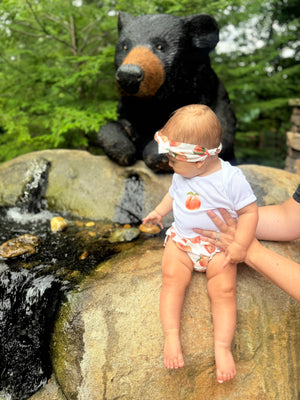 White Baby Onesie w/ Peach Detail
