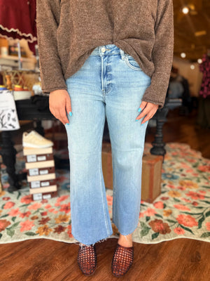 Risen Light Wash Mid Rise Wide Leg Raw Hem Jeans