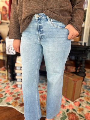Risen Light Wash Mid Rise Wide Leg Raw Hem Jeans