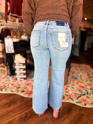 Risen Light Wash Mid Rise Wide Leg Raw Hem Jeans